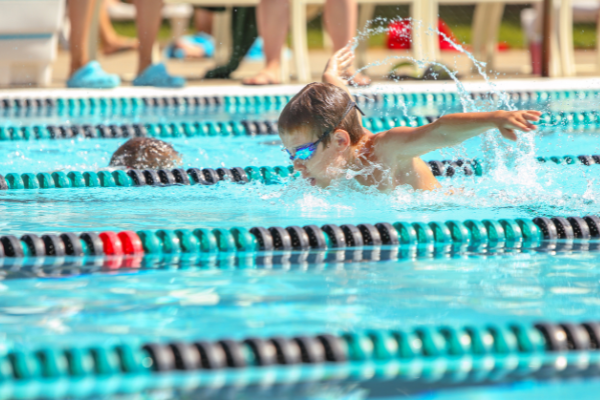 instructor leading a water aerobics class